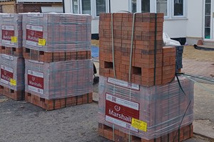 six large pallets of bricks on the highway without a valid license in place