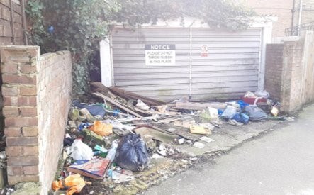A fly tip of rubbish left on the road